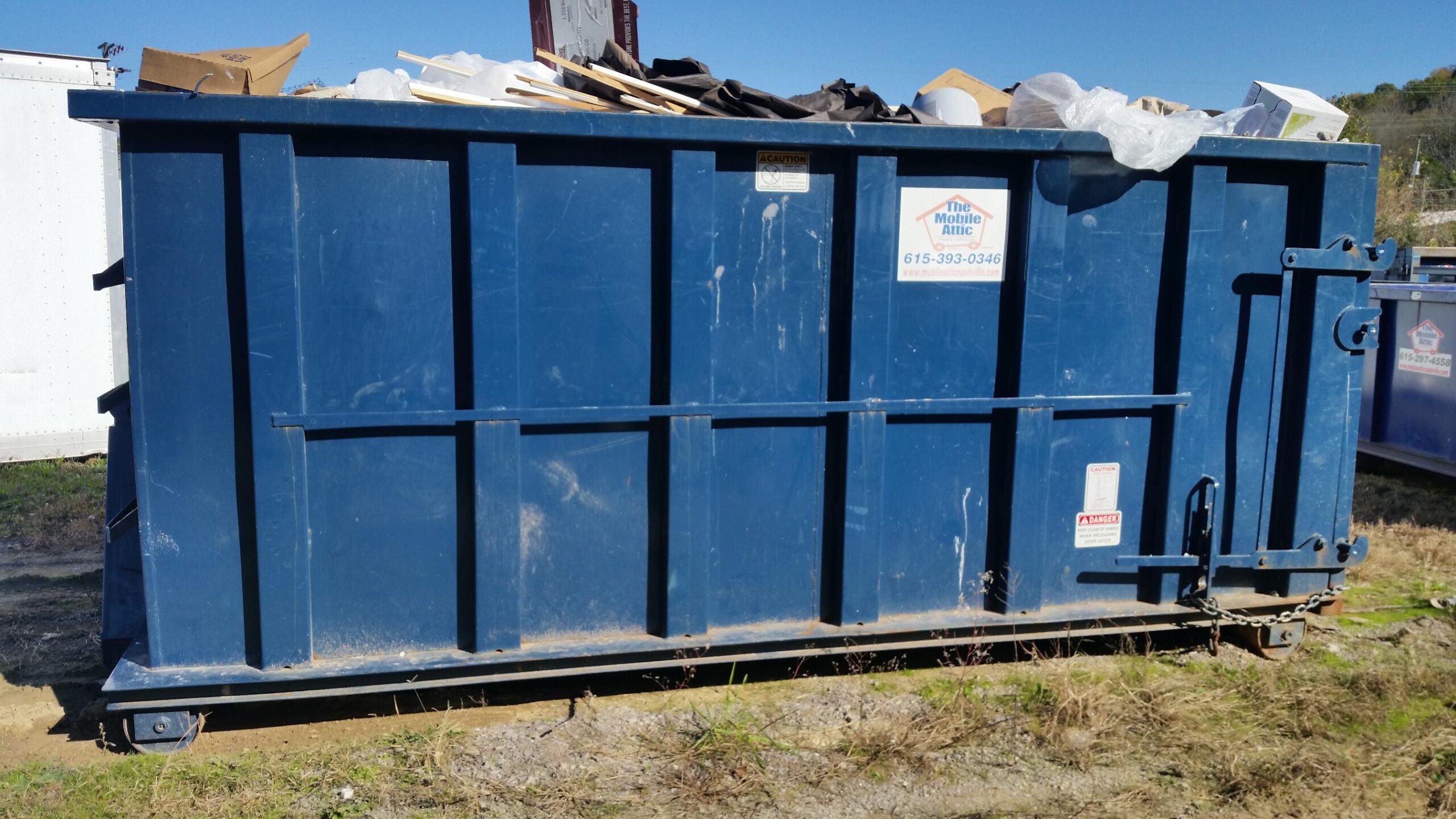 licensed dumpster rental container ready for safe waste removal