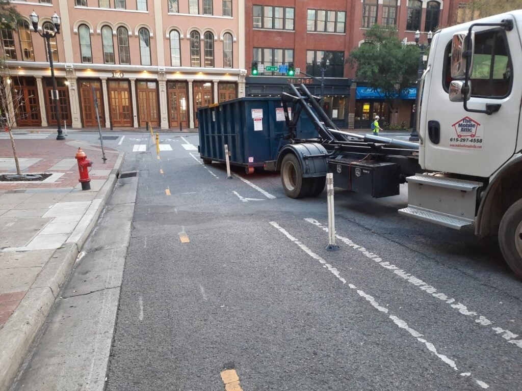 Mobile Attic delivering roll off dumpster to residential property