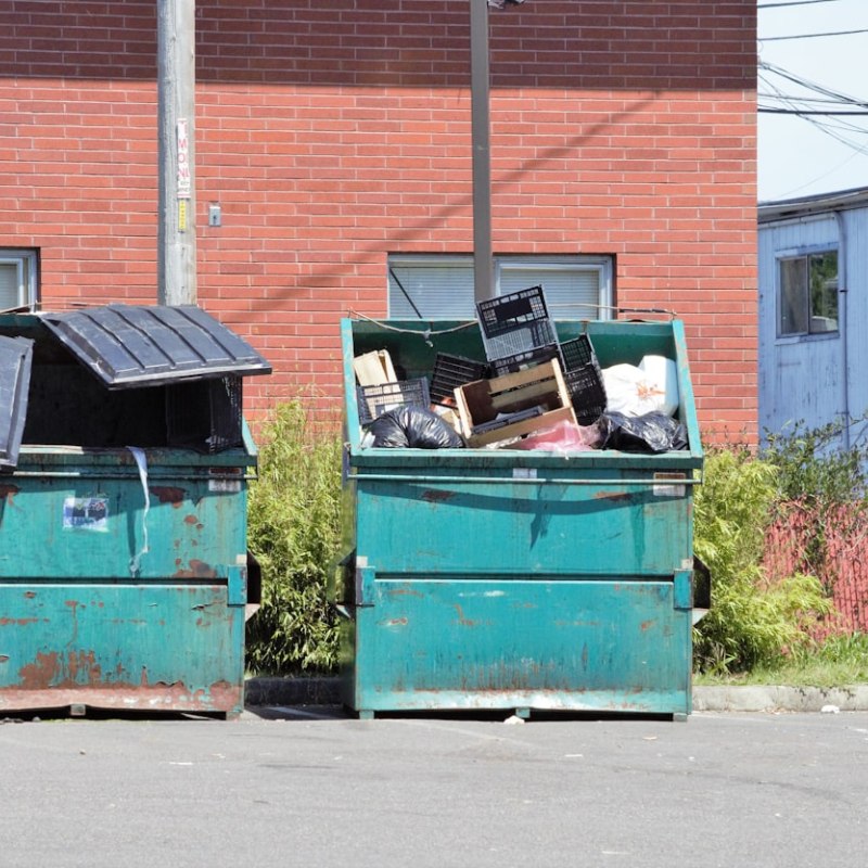 Commercial Dumpster Rental in Portland, TN with front-load dumpsters for reliable business waste disposal