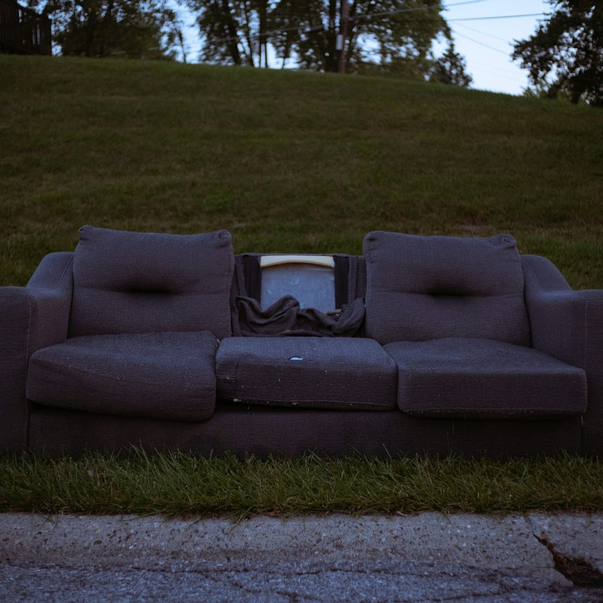 Discarded commercial furniture ready for removal, representing Commercial Dumpster Rental in Pegram, TN.