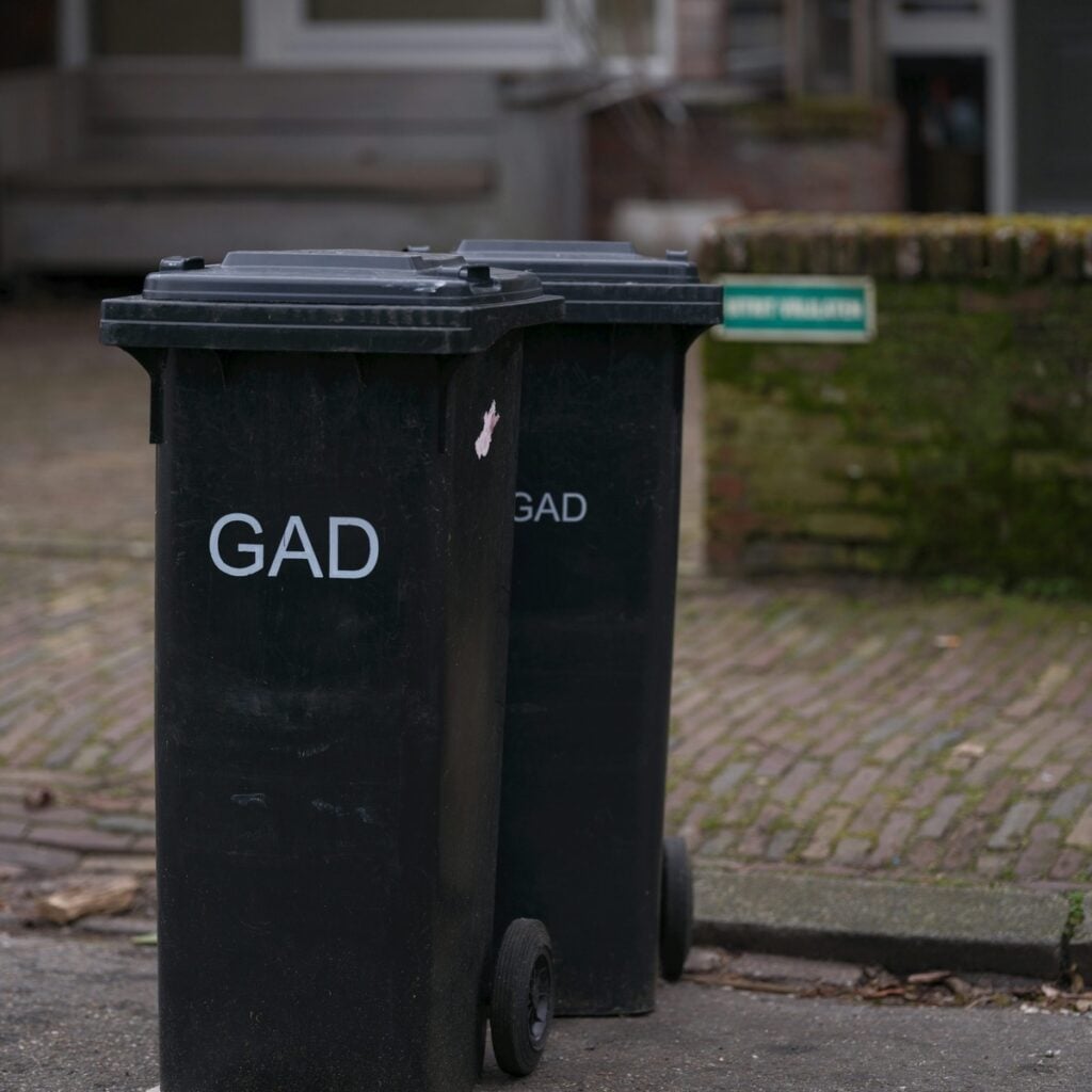 Commercial waste containers positioned for routine business disposal, representing commercial dumpster rental near me.